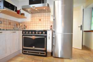 large oven and stainless steel fridge
